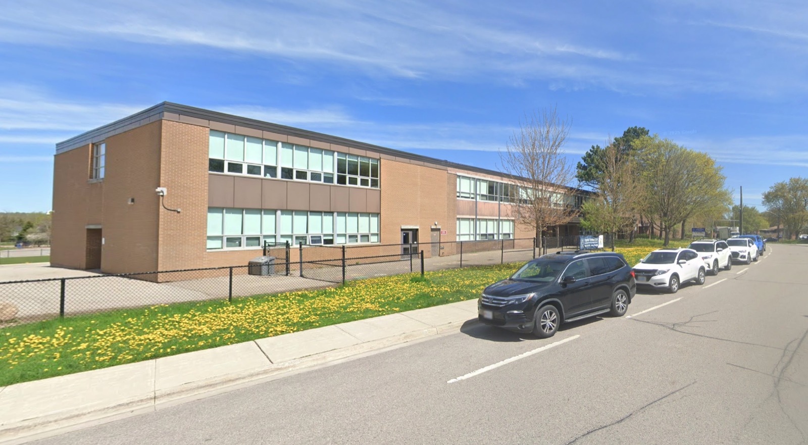 St. Joseph School from Glass Drive today, with the newer addition stretching right past the original brick block